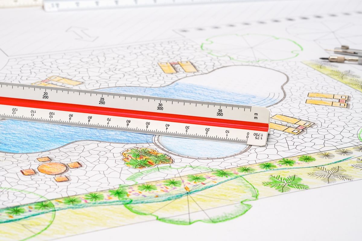 Landscape architect design backyard pool plan with metric scale ruler