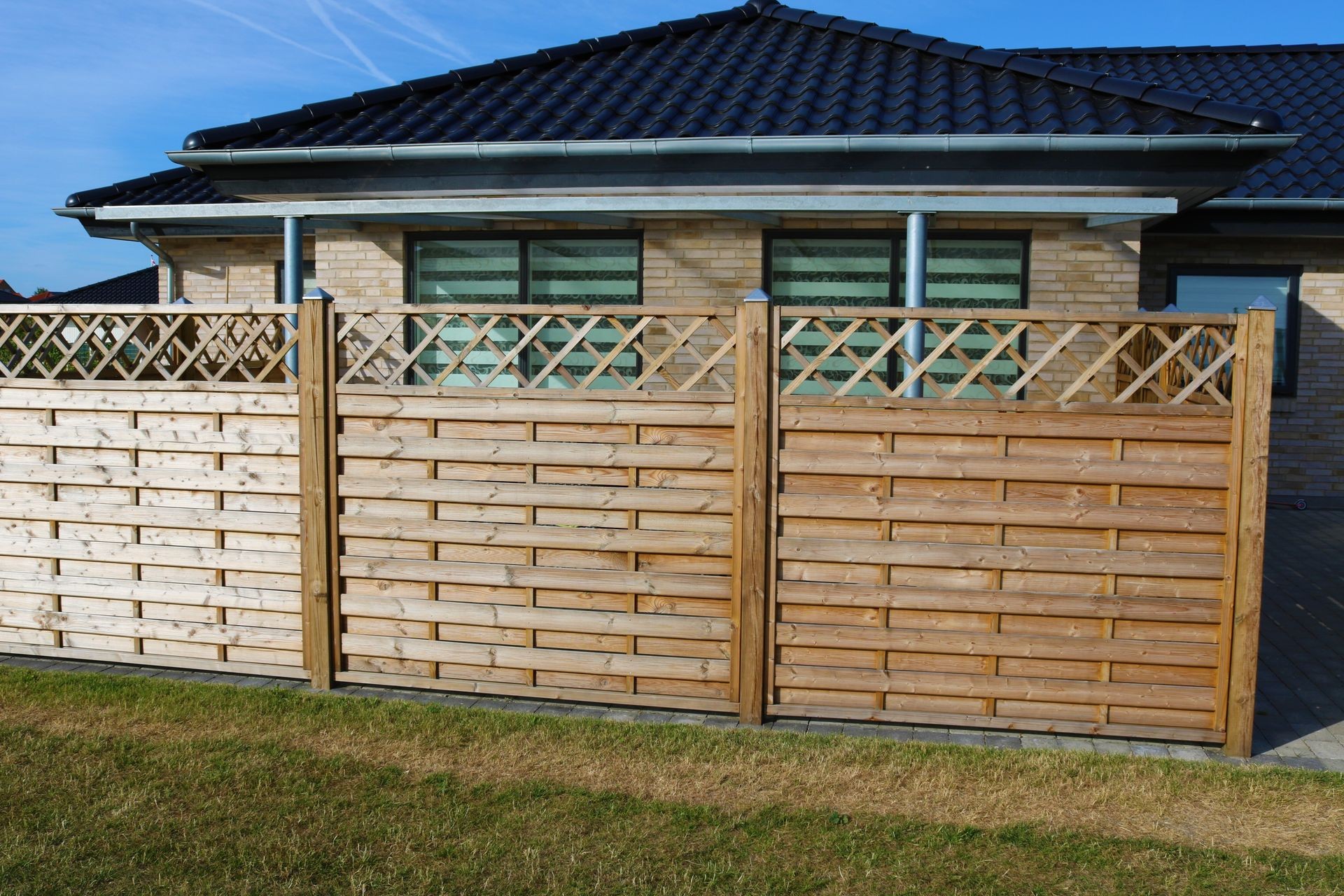 Wooden fence. Terrace fence. Wooden fence with privacy lattice screen.